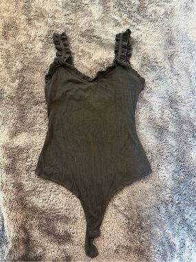 Flattering Black Ruffle Bodysuit